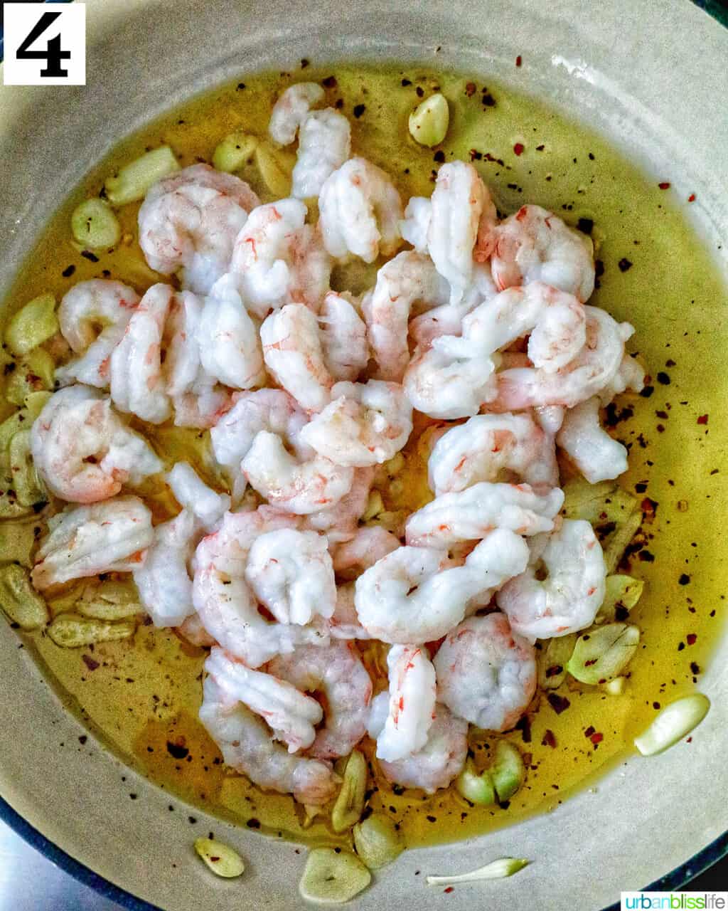 skillet of shrimp in garlic olive oil.
