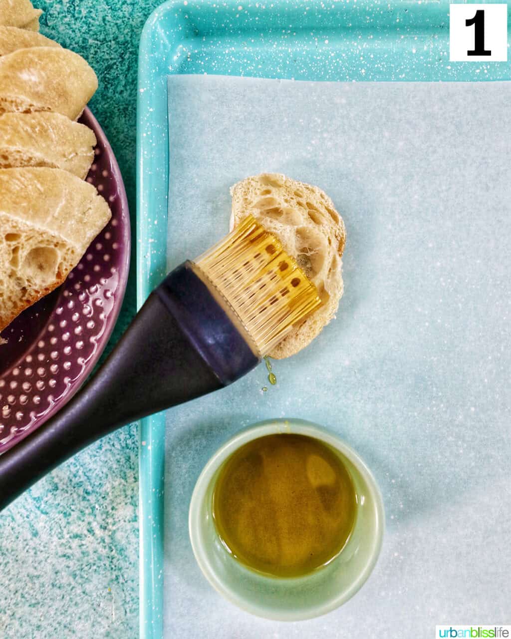 brushing olive oil onto baguette slices.