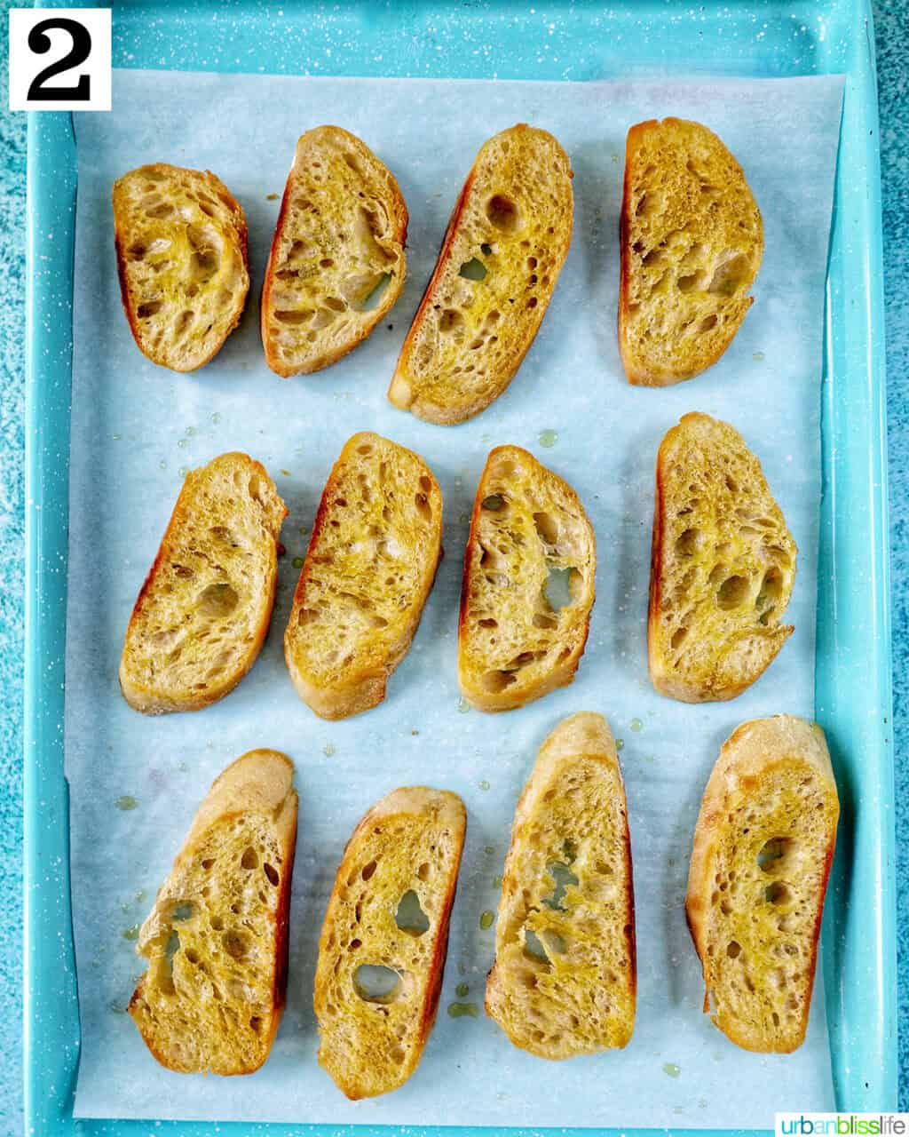 baguette slices on a baking sheet.
