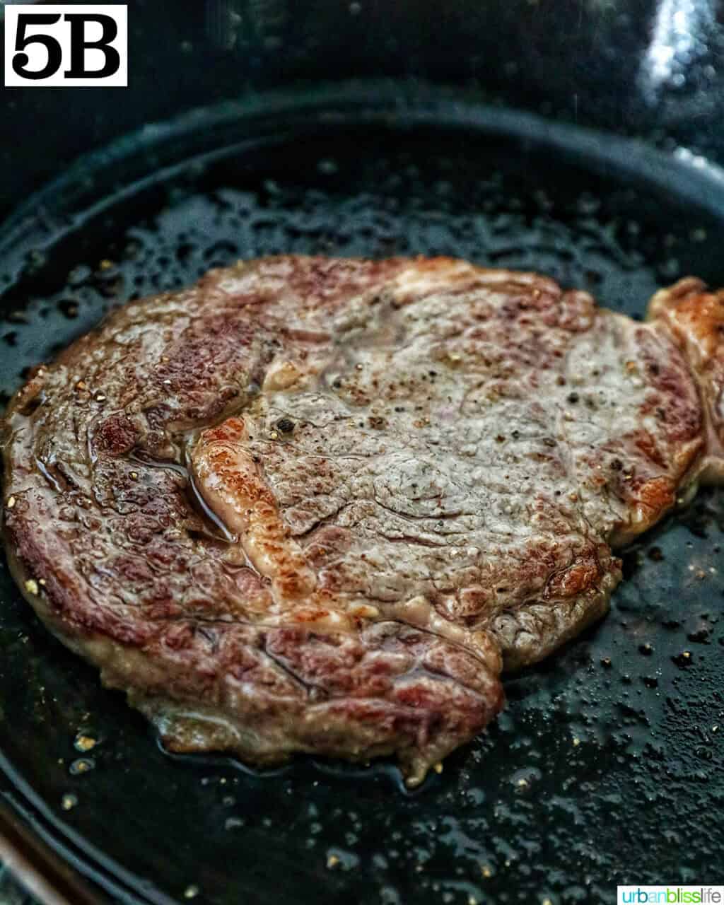 steak in a cast iron skillet.