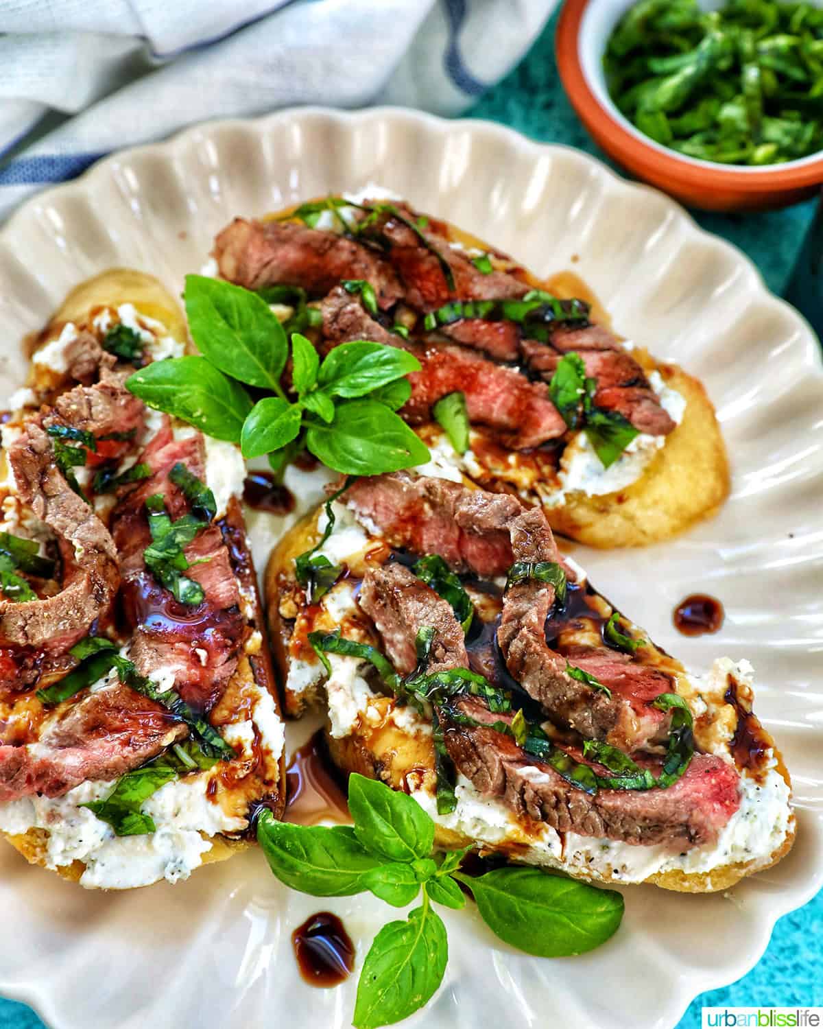 more steak crostini on a plate.