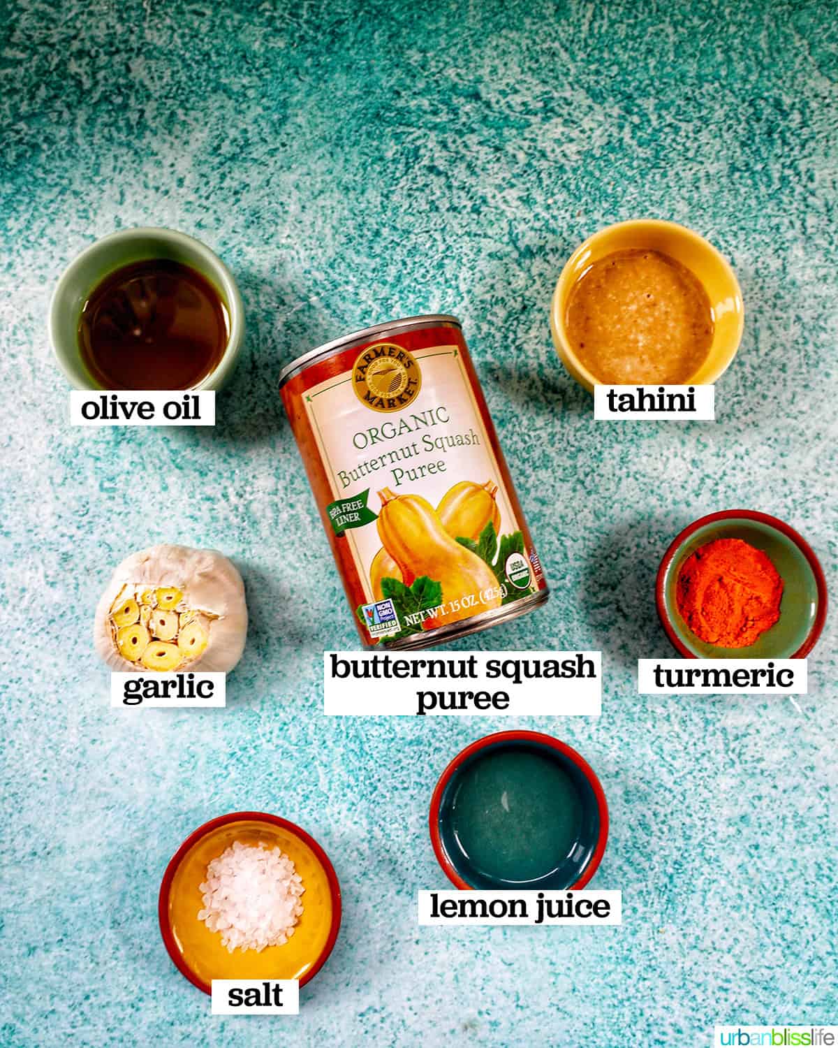 bowls of ingredients to make butternut squash dip with roasted garlic.