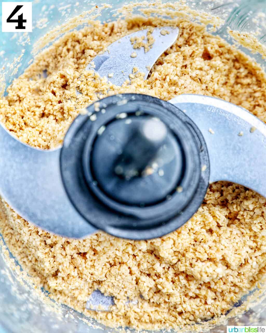 food processor with sesame seeds pulsed to make tahini.