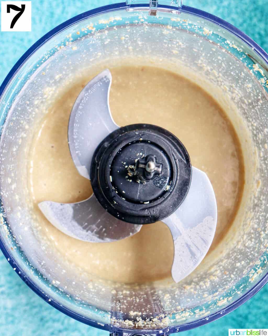 smooth tahini in a food procesor bowl.