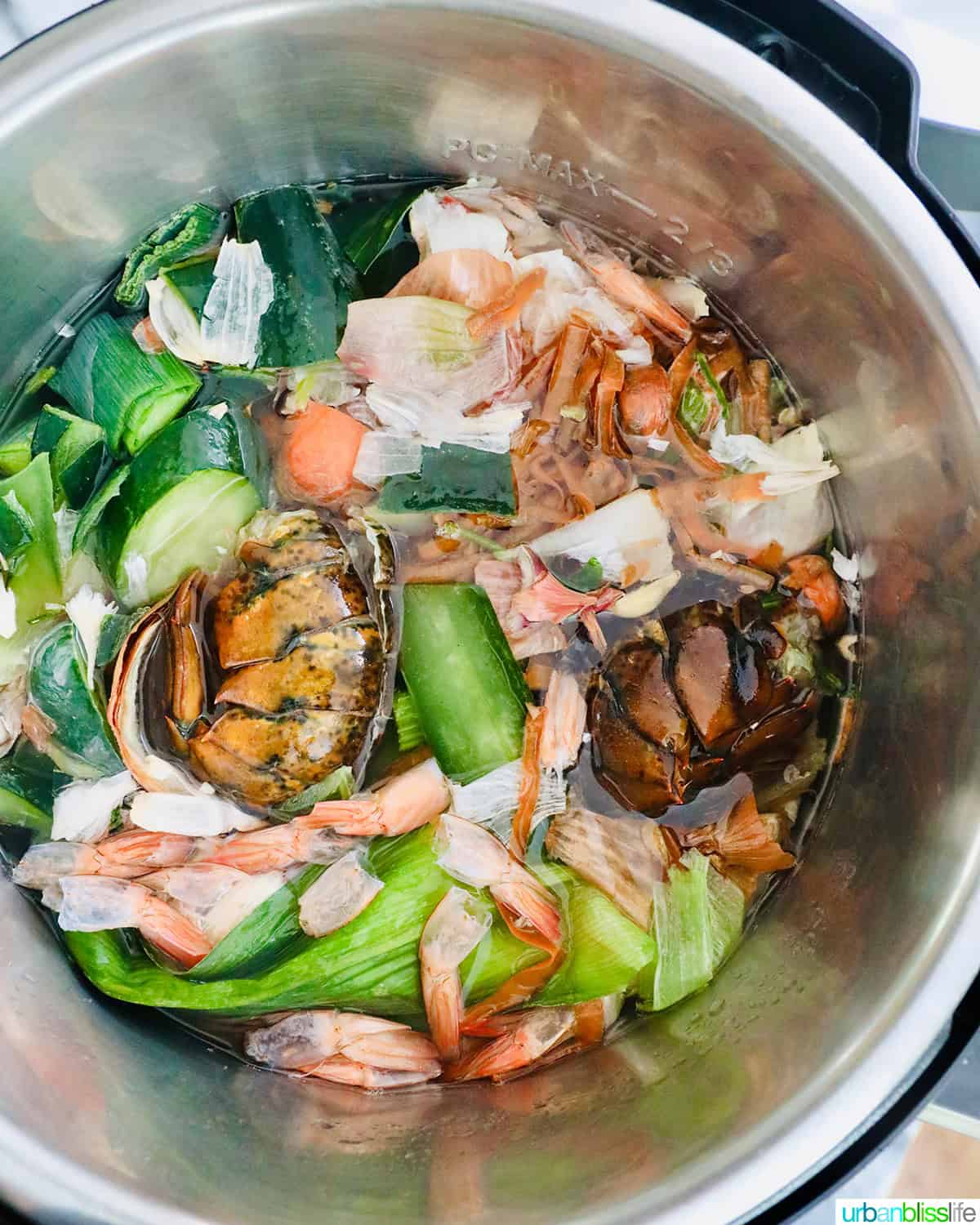 Instant Pot of seafood shells and vegetable scraps to make seafood stock.