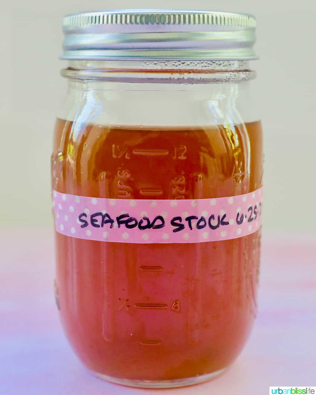 mason jar labeled seafood stock.