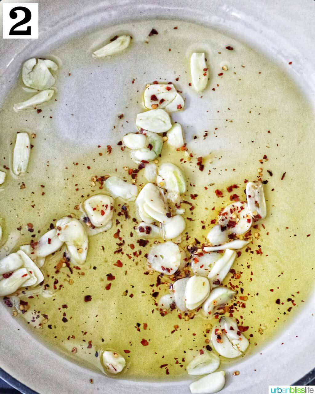 garlic and red pepper flakes cooking in oil.