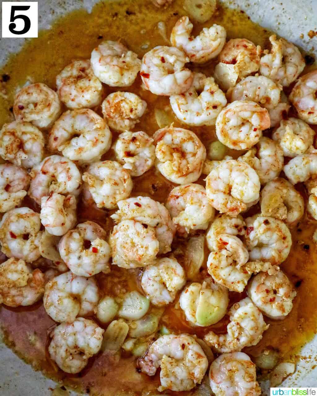 spanish prawns cooking in a pan.