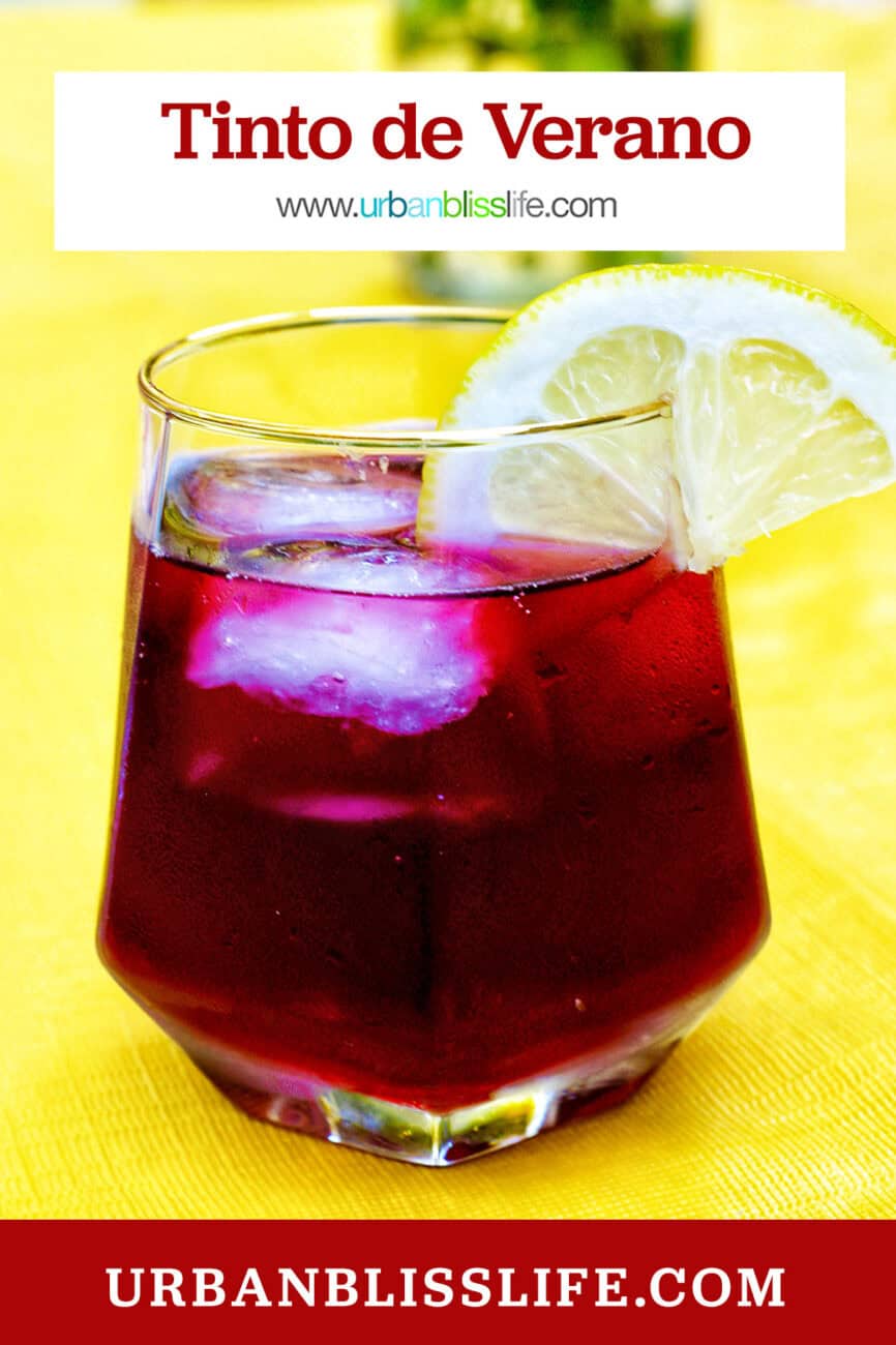 glass of tinto de verano wine cocktail with lemon slice.