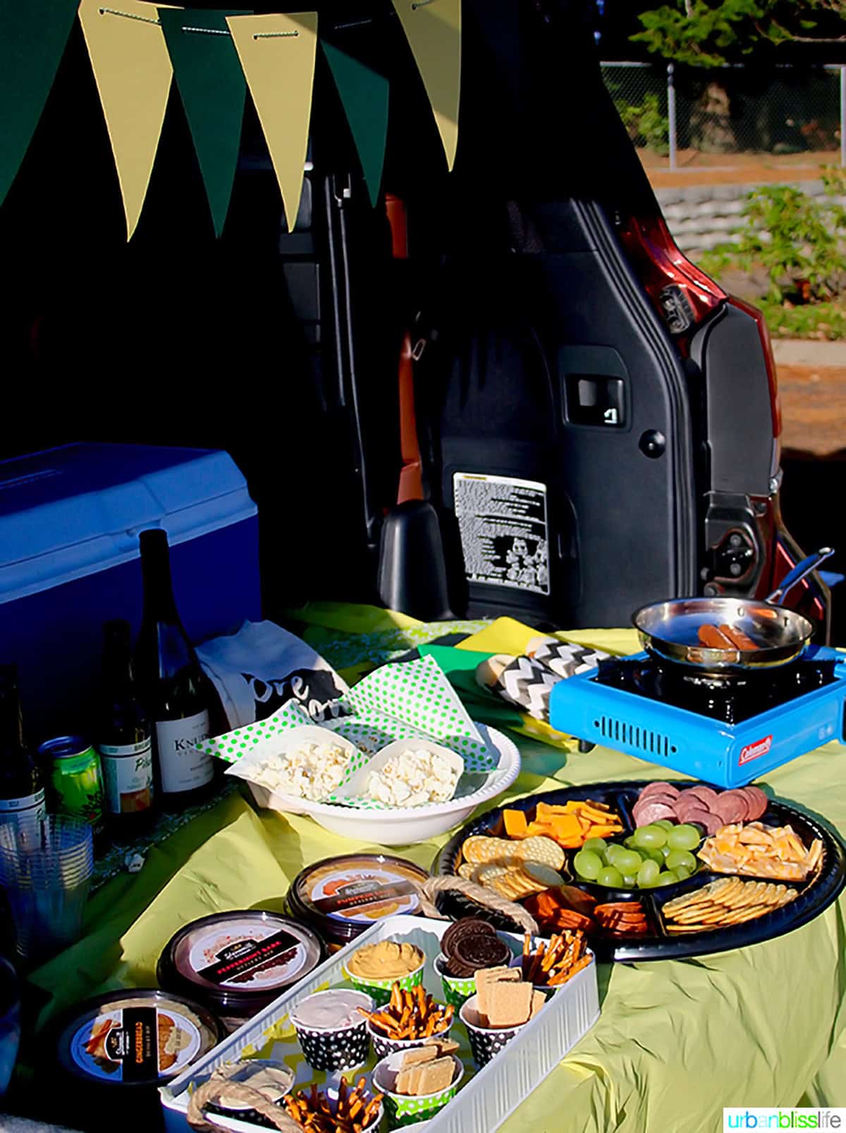 tailgating food spread in the back of a car.