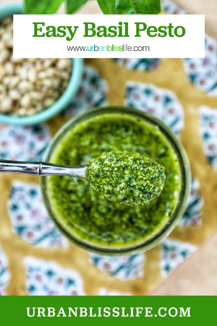 jar and spoonful of fresh basil pesto with side of pine nuts on a colorful napkin and title text overlay.