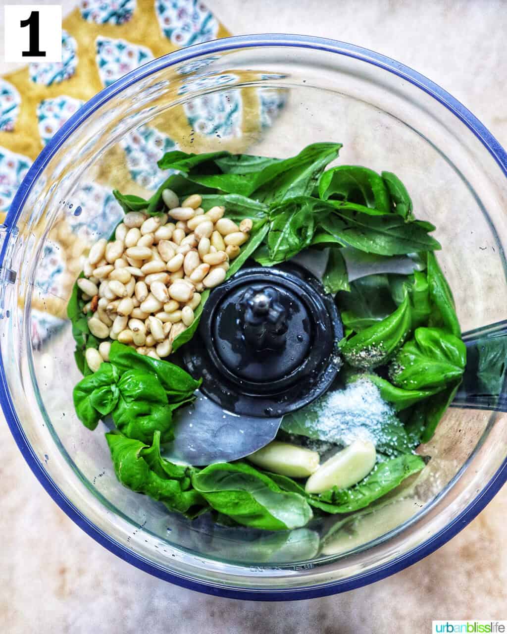 ingredients to make pesto in a food processor.