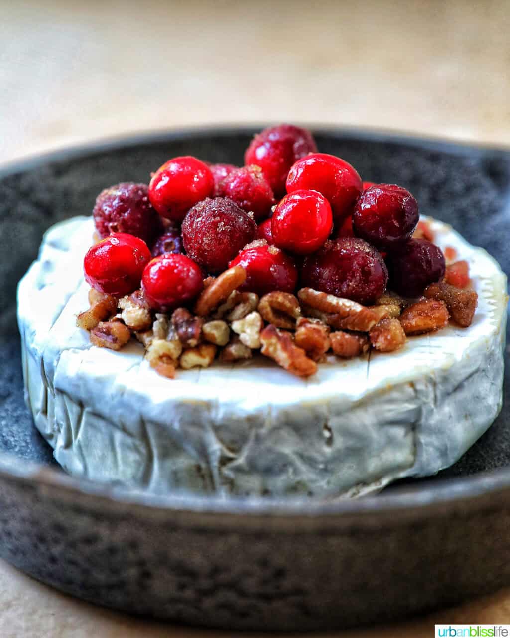 cranberry pecan baked brie in a skillet.