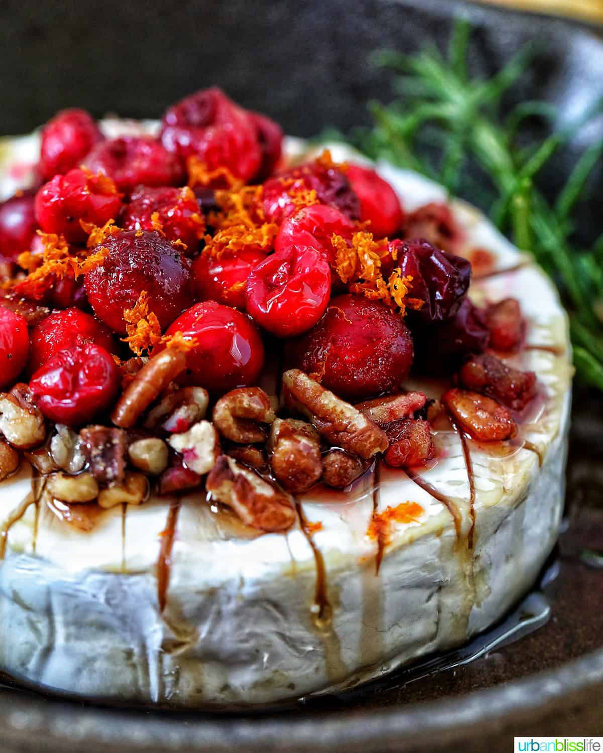 cranberry pecan baked brie in a skillet.