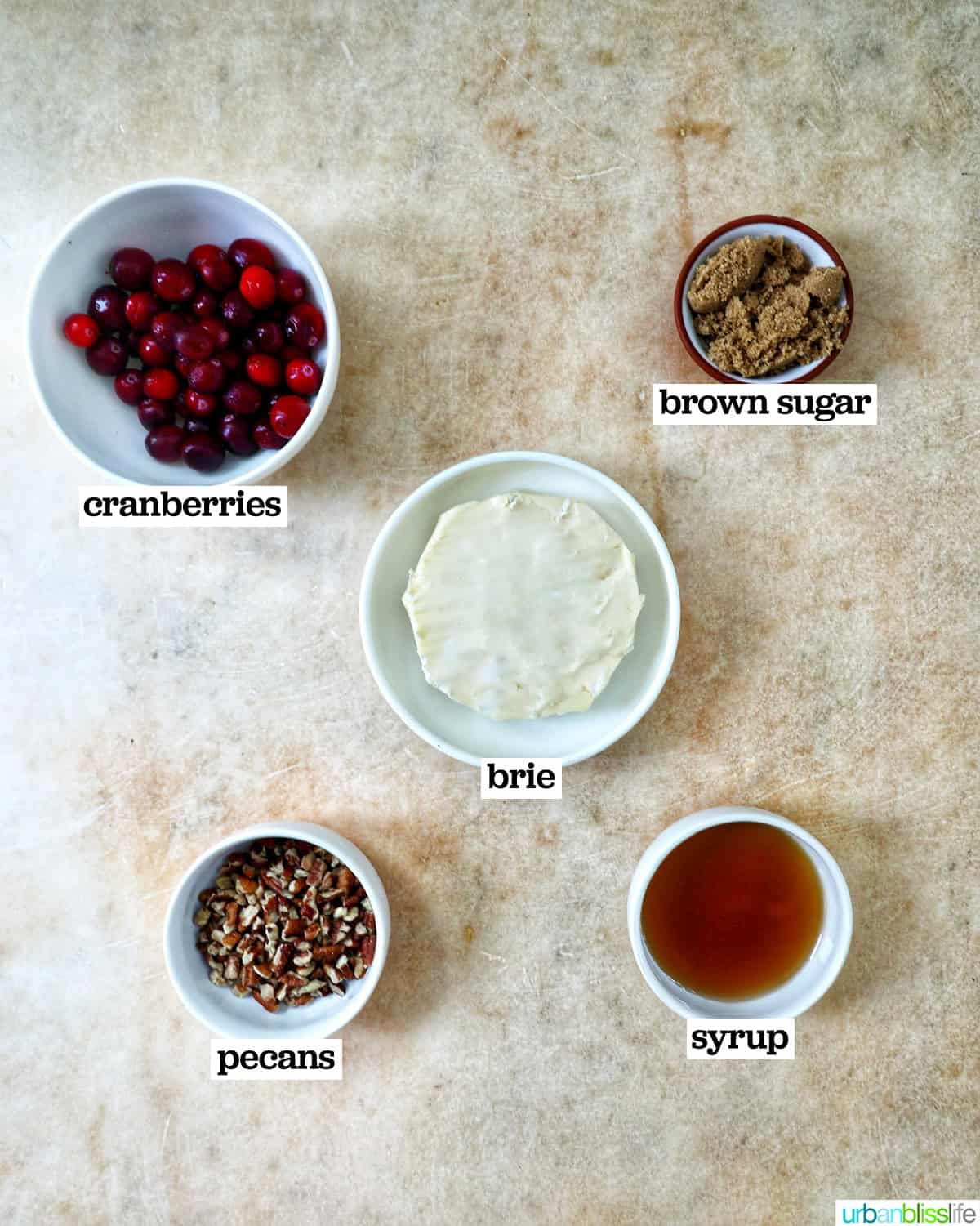 bowls of ingredients to make cranberry pecan baked brie.