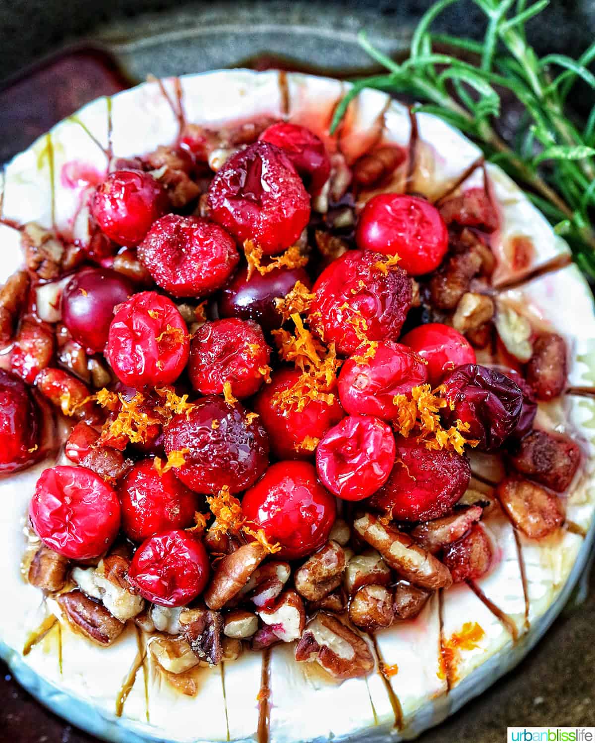 cranberry pecan baked brie in a skillet.