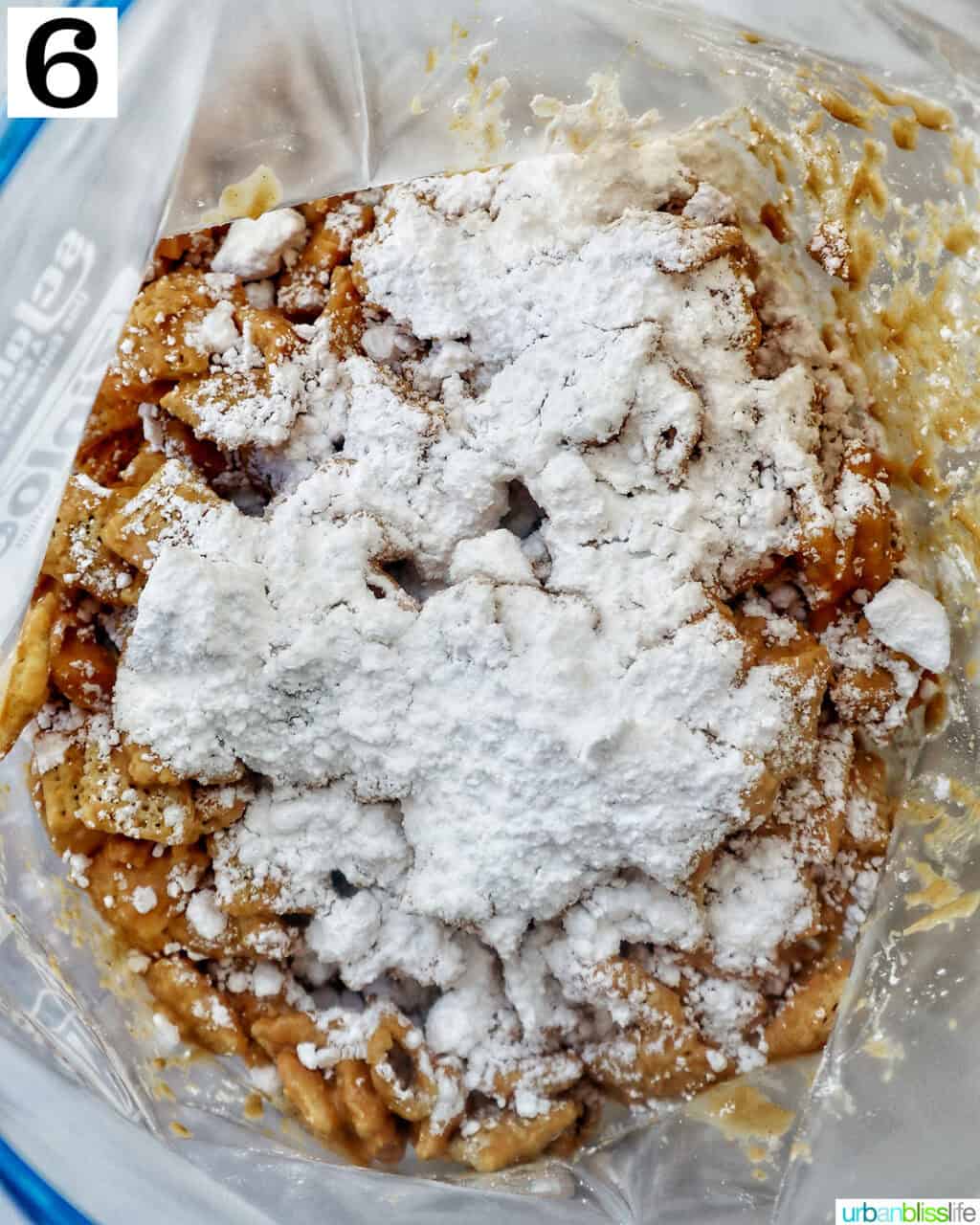 adding powdered sugar to patriotic puppy chow in a large plastic bag.