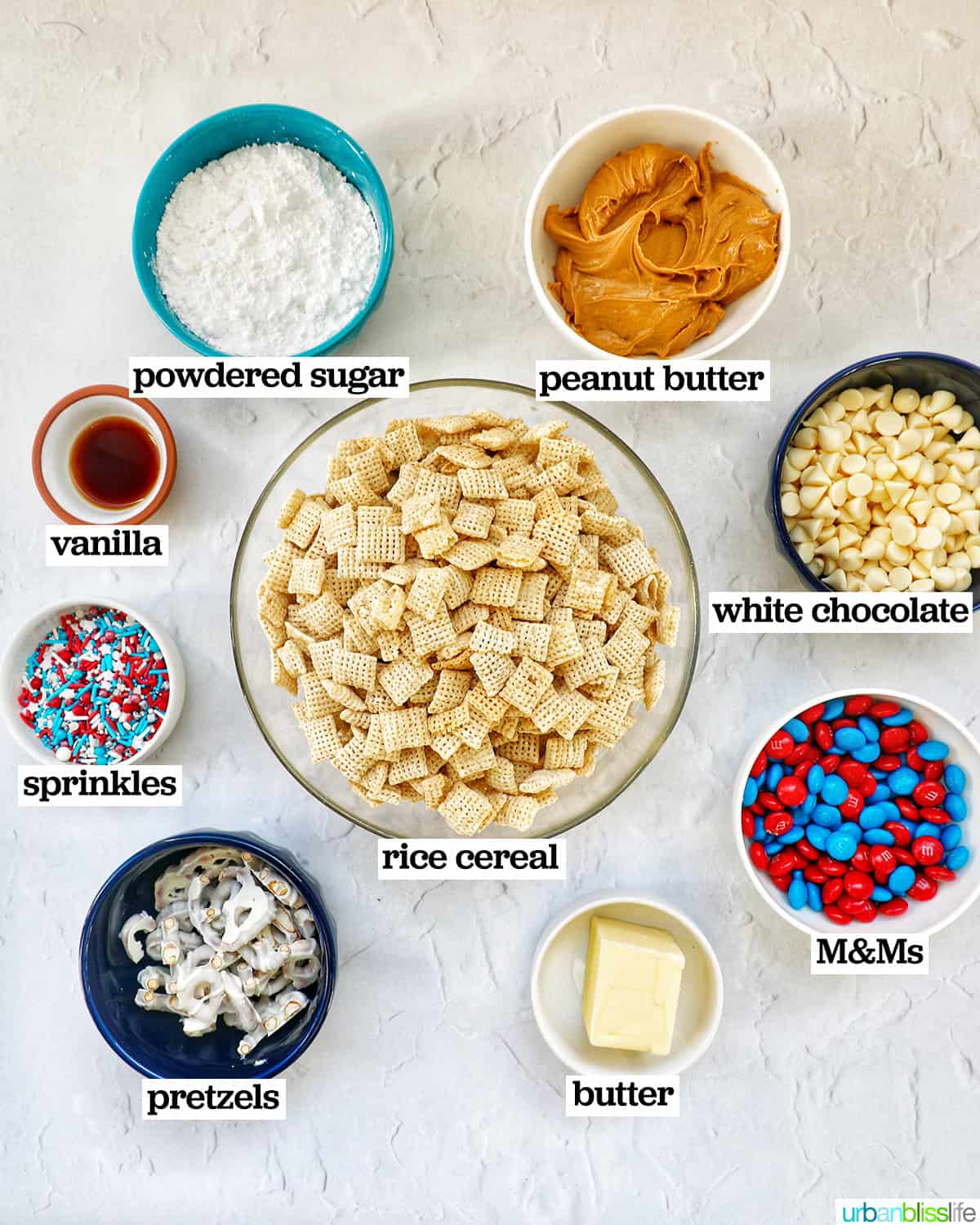 ingredients in bowls to make patriotic puppy chow.