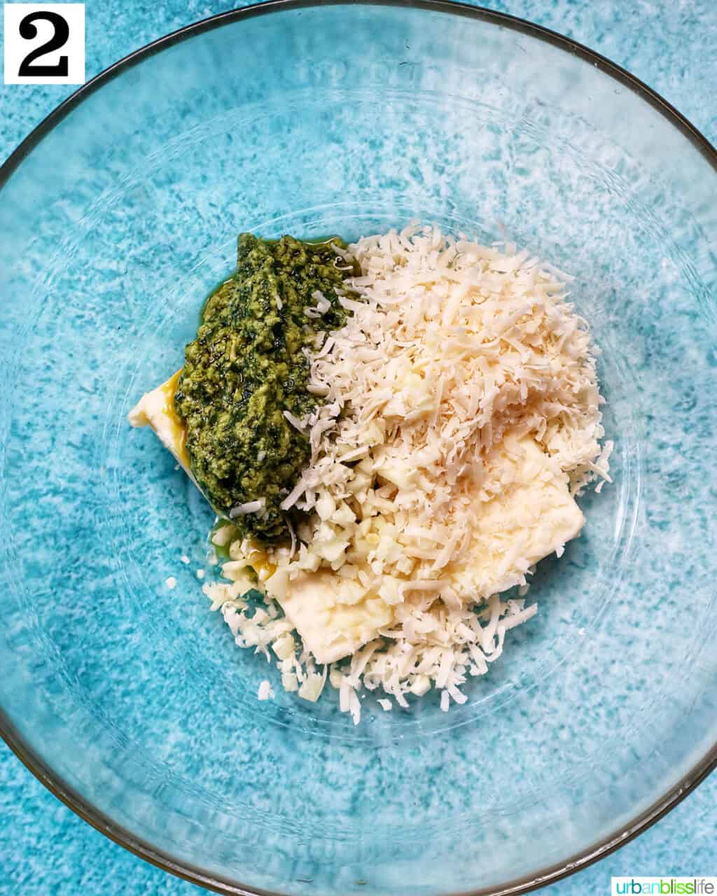 ingredients to make pesto spread in a bowl.