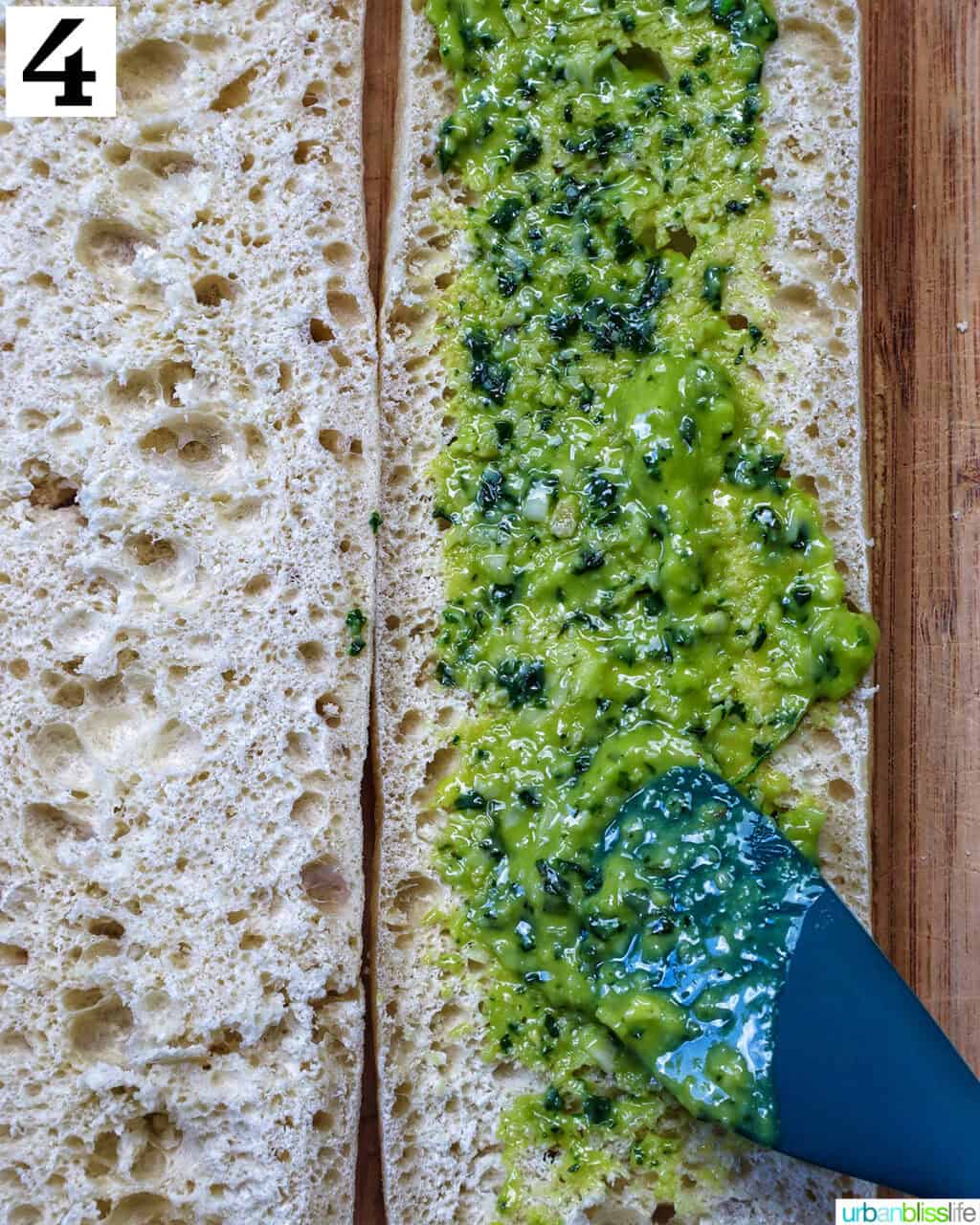 spreading pesto onto baguette slices.