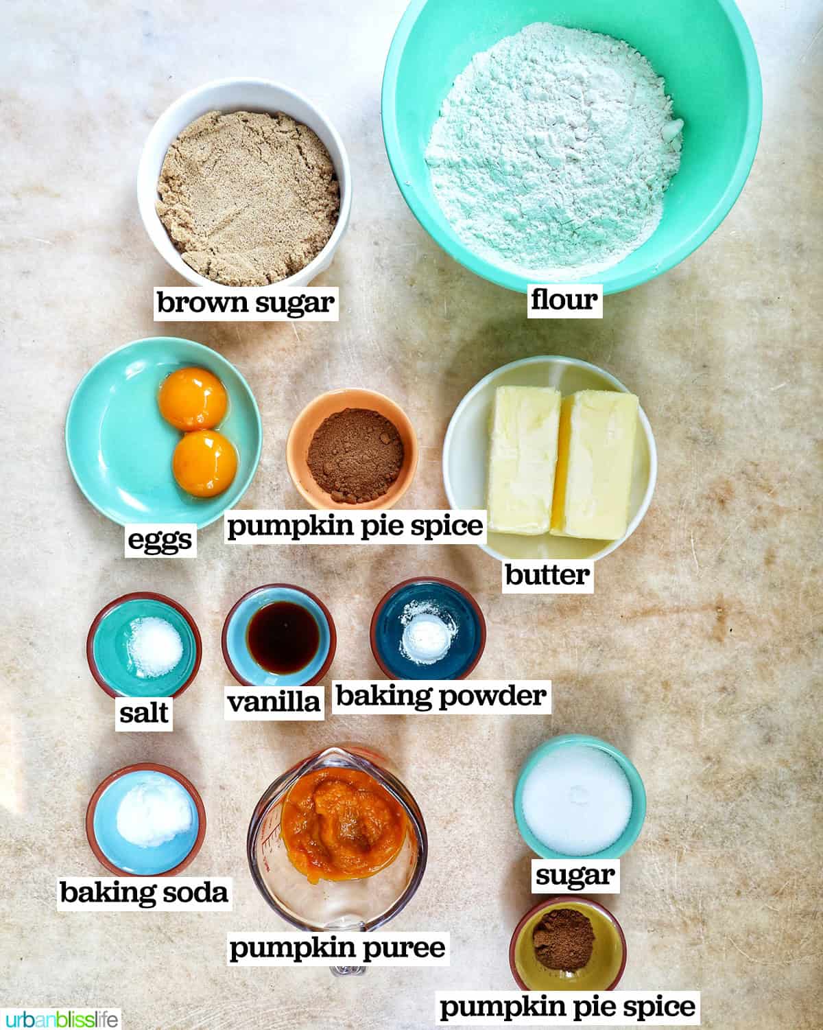 bowls of ingredients to make pumpkin pie spice cookies.