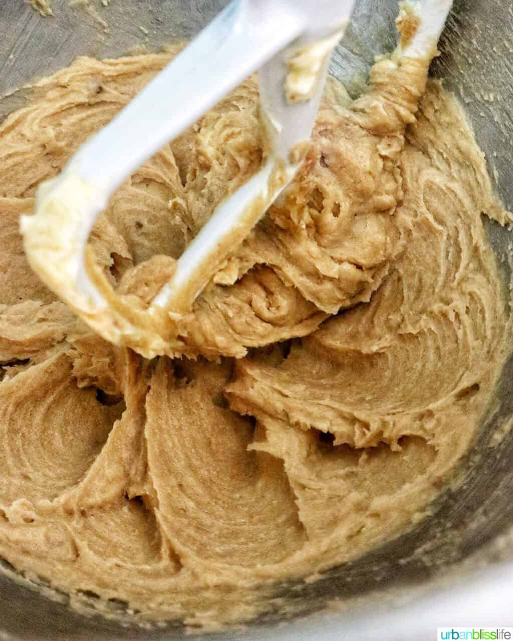 pumpkin pie spice batter in a stand mixer bowl.
