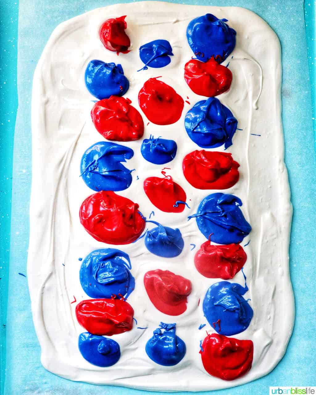 red, white, and blue melted chocolate on a baking sheet.