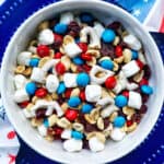 red white and blue trail mix in a bowl.