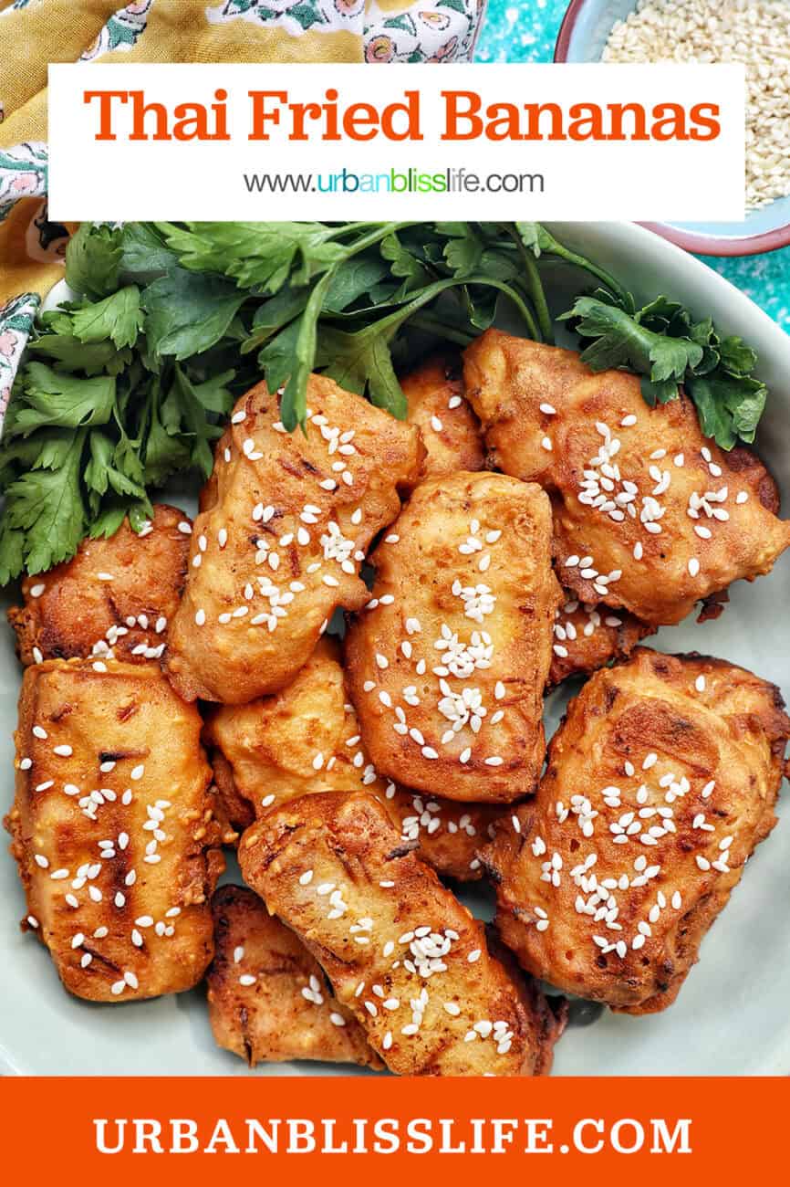 bowl of Thai fried bananas dessert with bowl of sesame seeds and herbs.