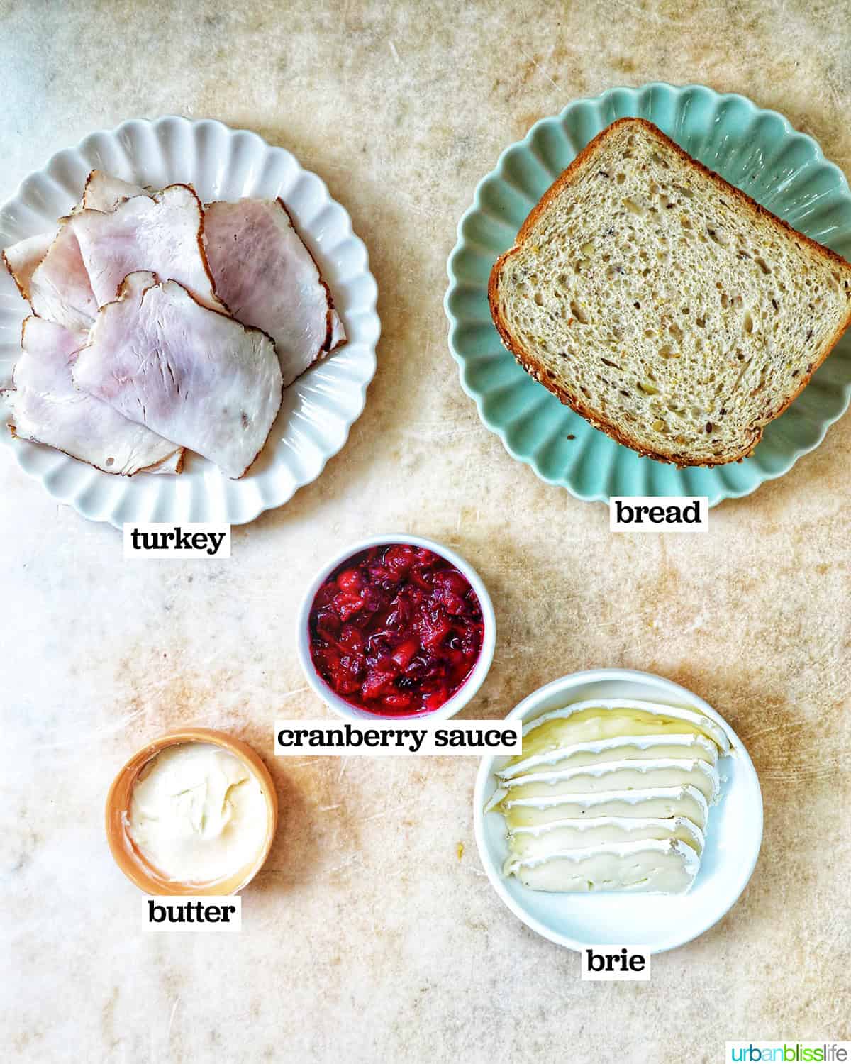 bowls of ingredients to make Turkey Cranberry Brie Sandwiches.