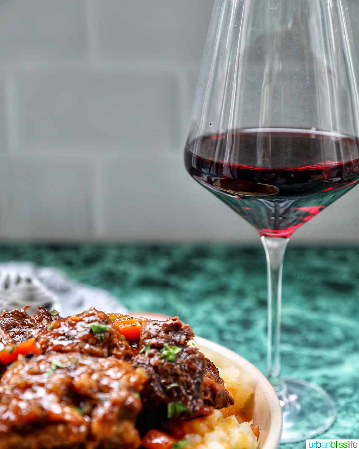 beer braised short ribs with glass of red wine.