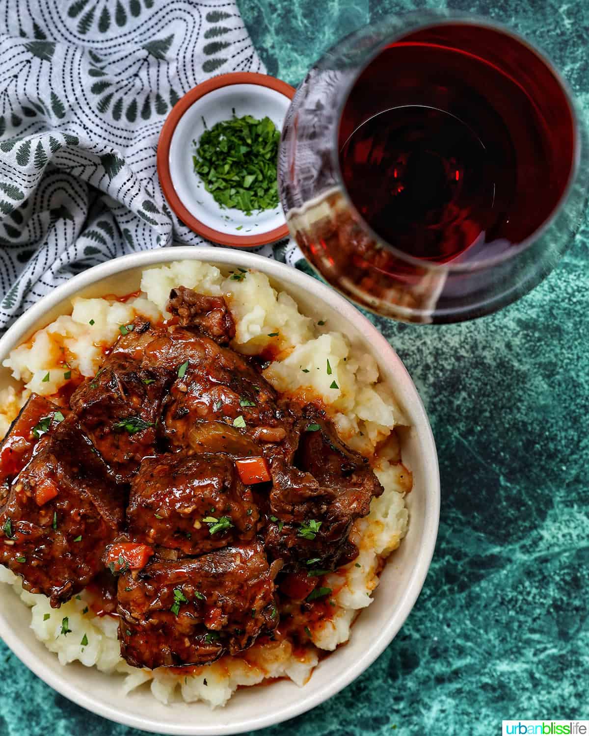 beer braised short ribs over mashed potatoes and a glass of red wine.