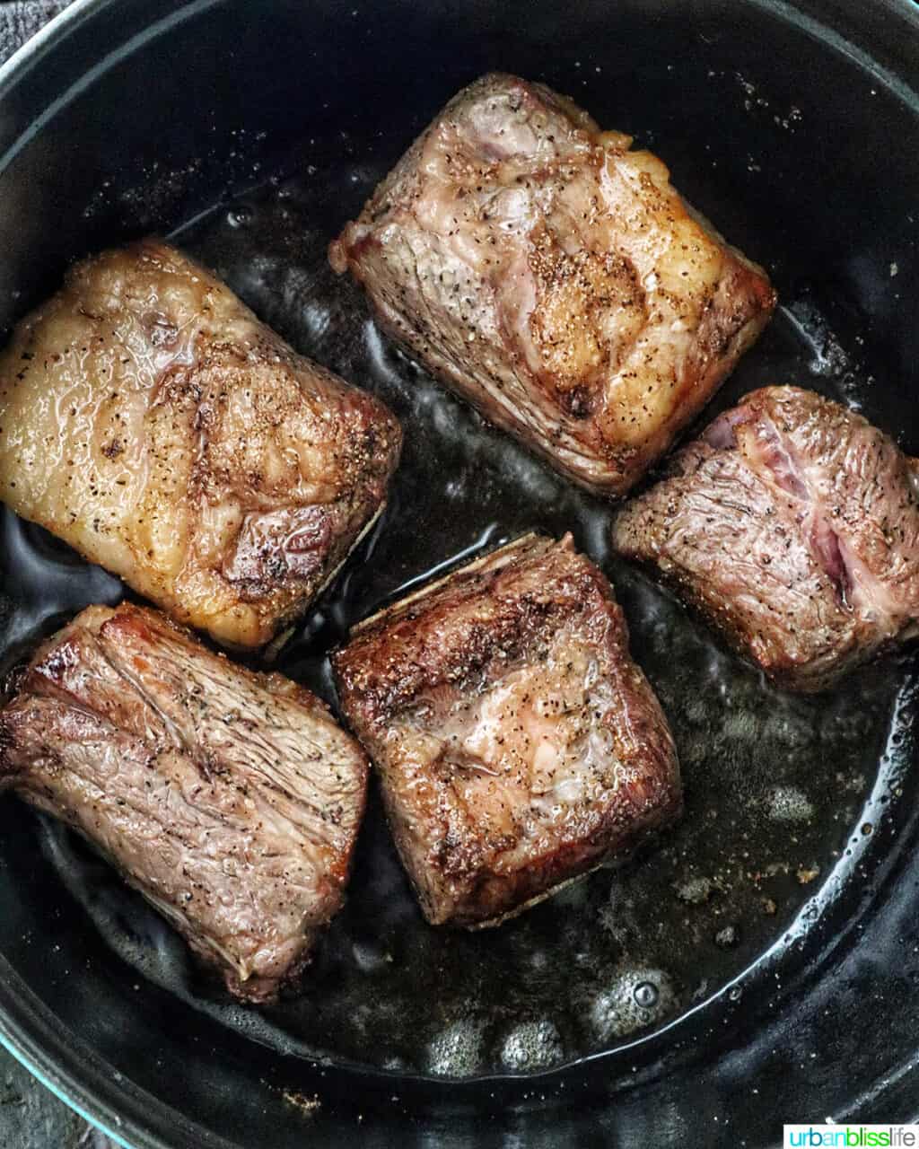 beef short ribs in a Dutch oven.