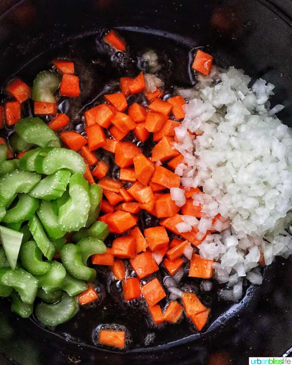 mirepoix of carrots, celery, and onions in a Dutch oven.