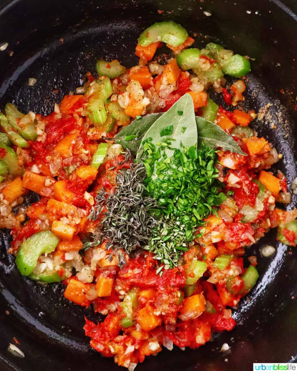 herbs added to mirepoix of carrots, celery, and onions in a Dutch oven.
