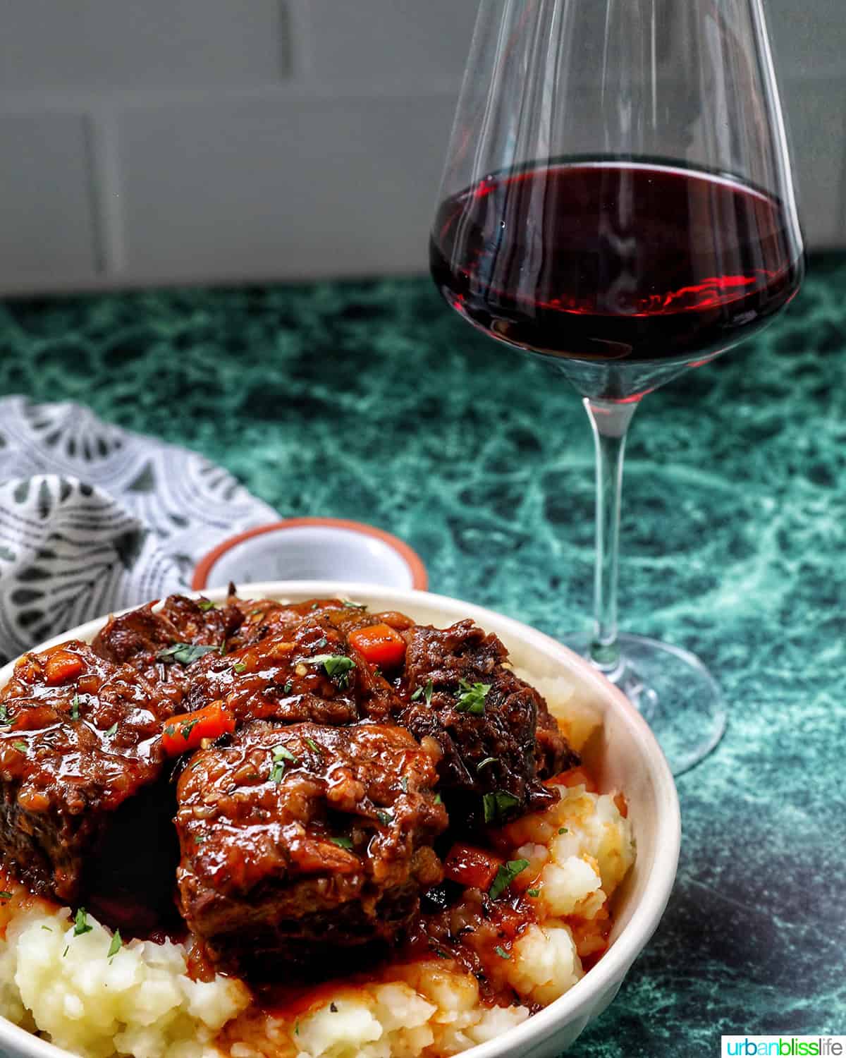 beer braised short ribs over mashed potatoes and a glass of red wine.