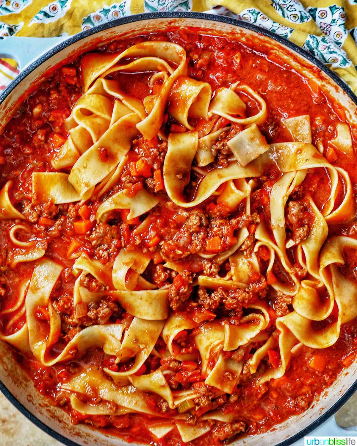 hearty lamb ragu pappardelle in a pan.