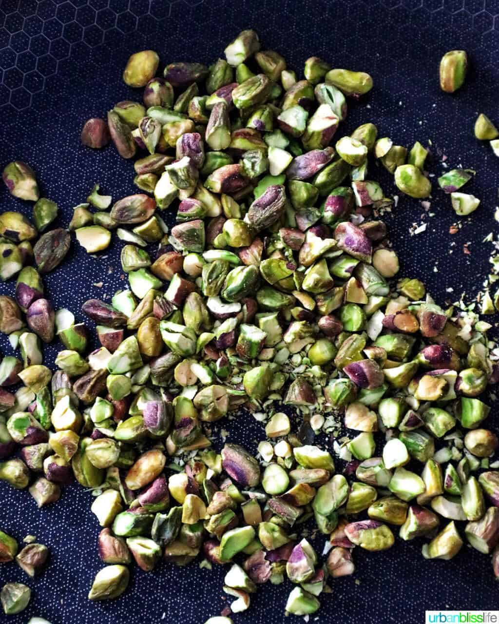 toasting pistachios on a pan.