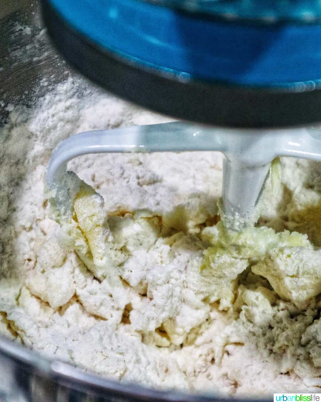 mixing pistachio cranberry shortbread cookie dough in a stand mixer.