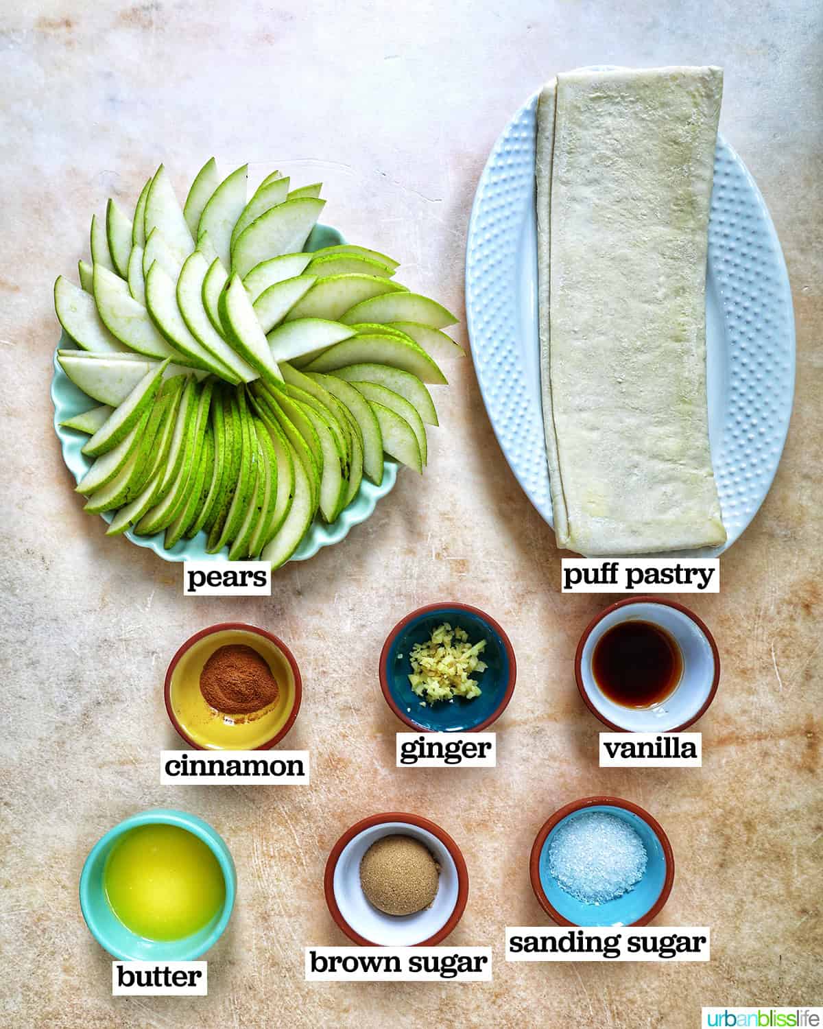 bowls of ingredients to make ginger and pear tart with puff pastry.