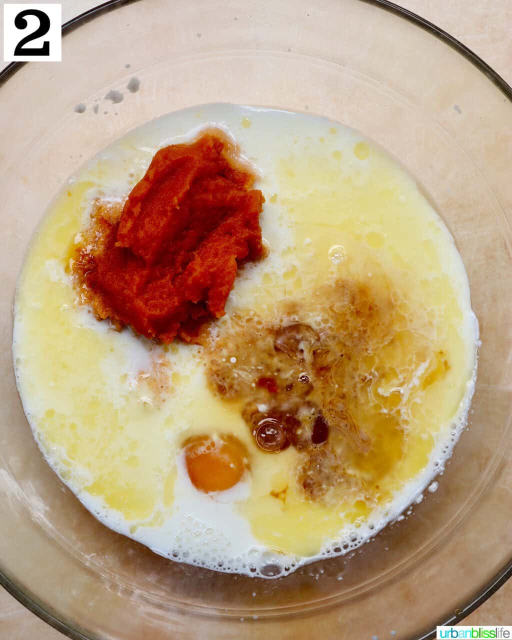 wet ingredients in a bowl to make pumpkin spice pancakes.