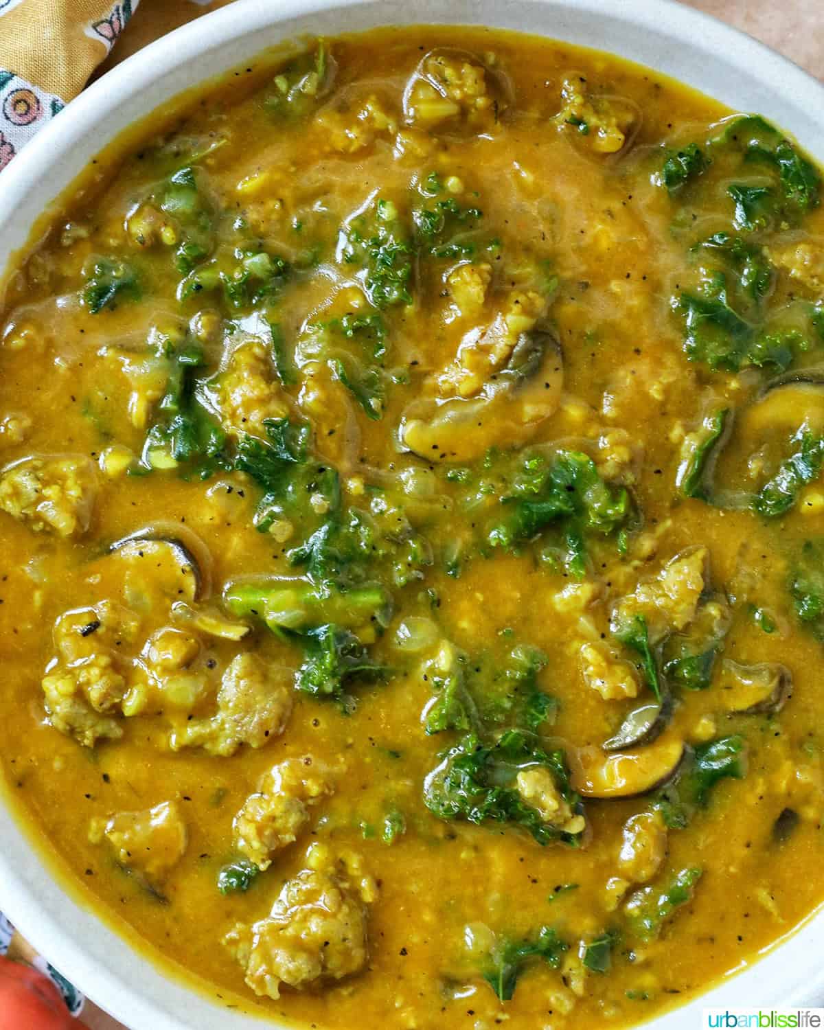 bowl of pumpkin soup with sausage.