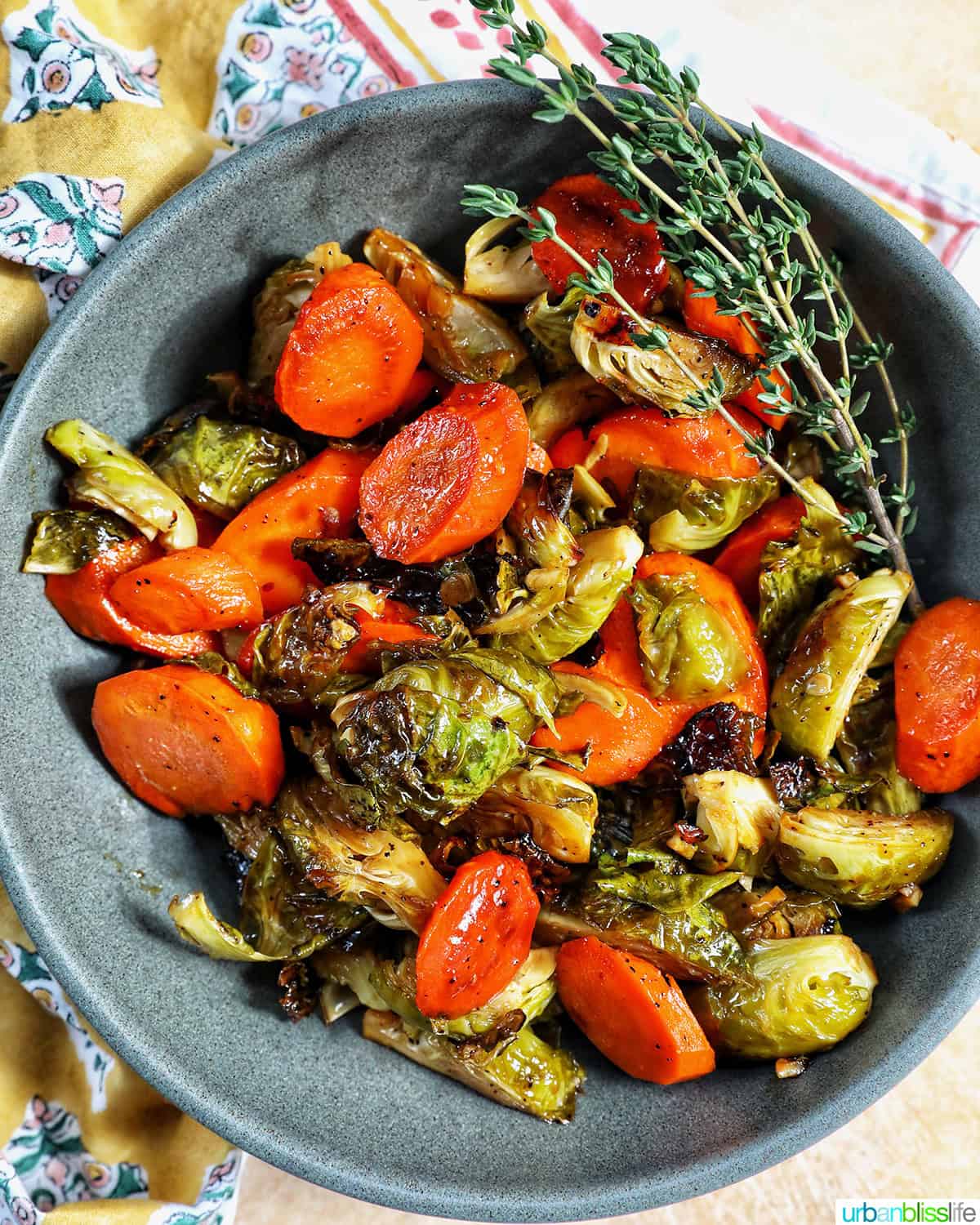 roasted brussels sprouts and carrot slices in a bowl.