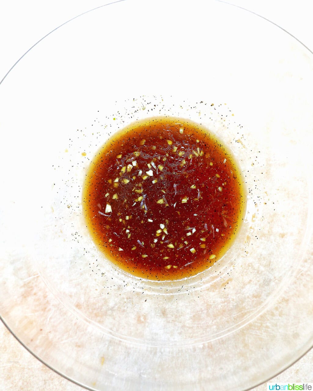 dressing mixed in a glass bowl.