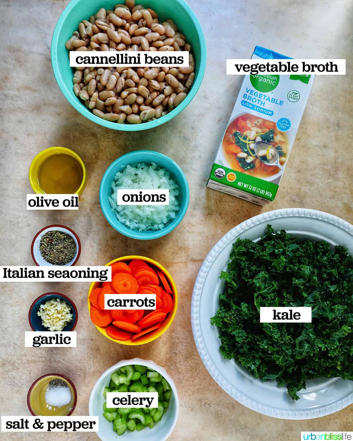 bowls of ingredients to make Tuscan kale and white bean soup.