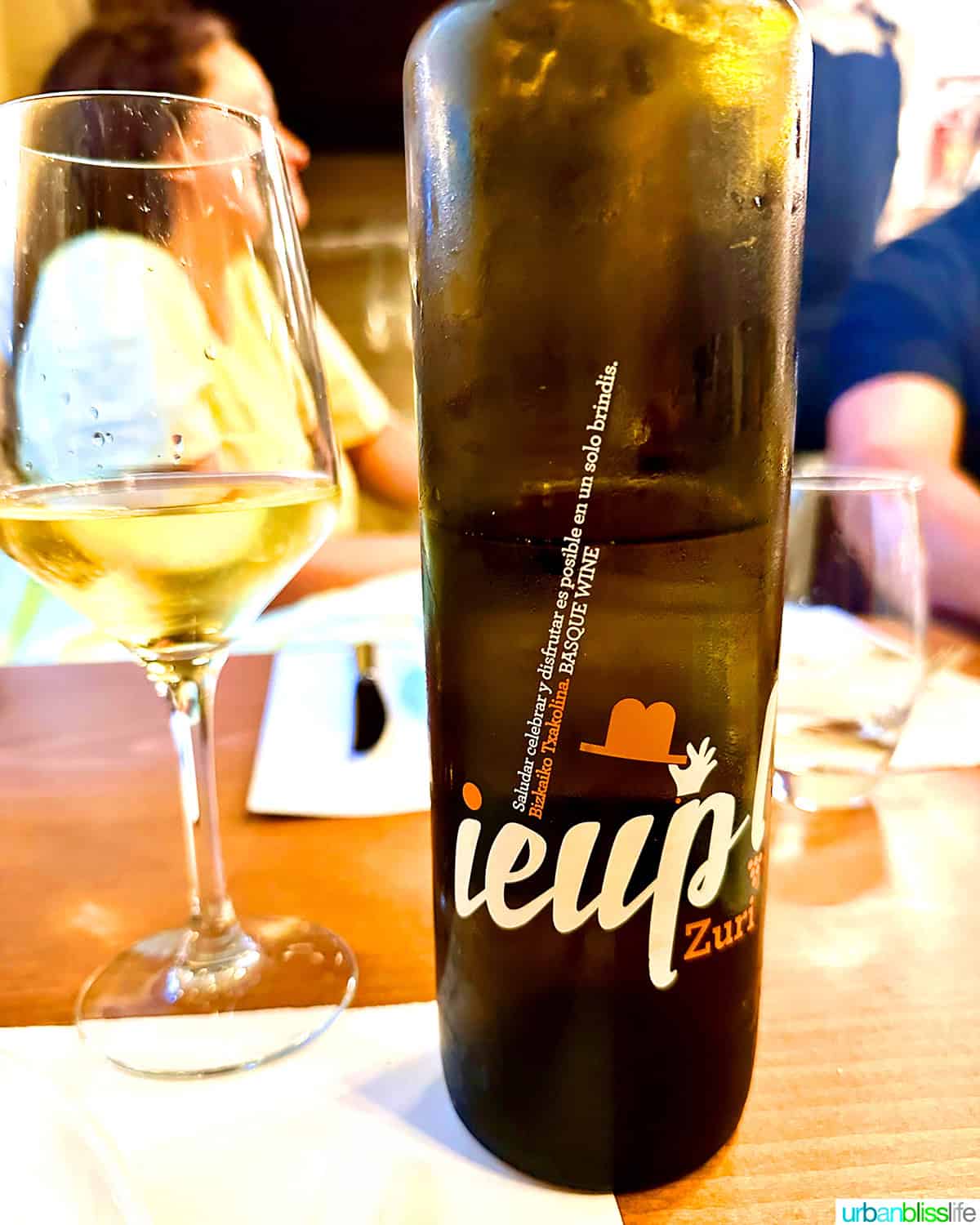 bottle and glass of txakoli wine