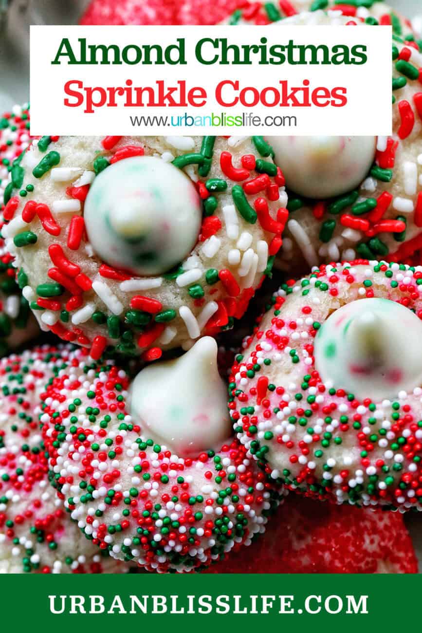 almond Christmas cookies with red and green sprinkles stacked on a plate with title text overlay.