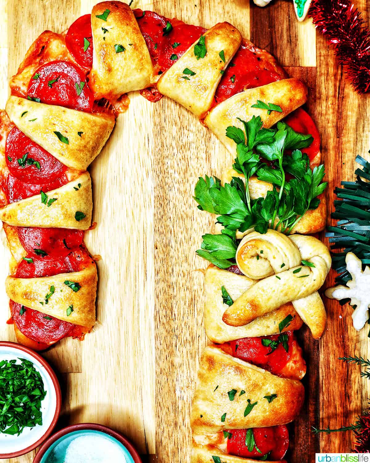 candy cane pizza surrounded by holiday decorations.