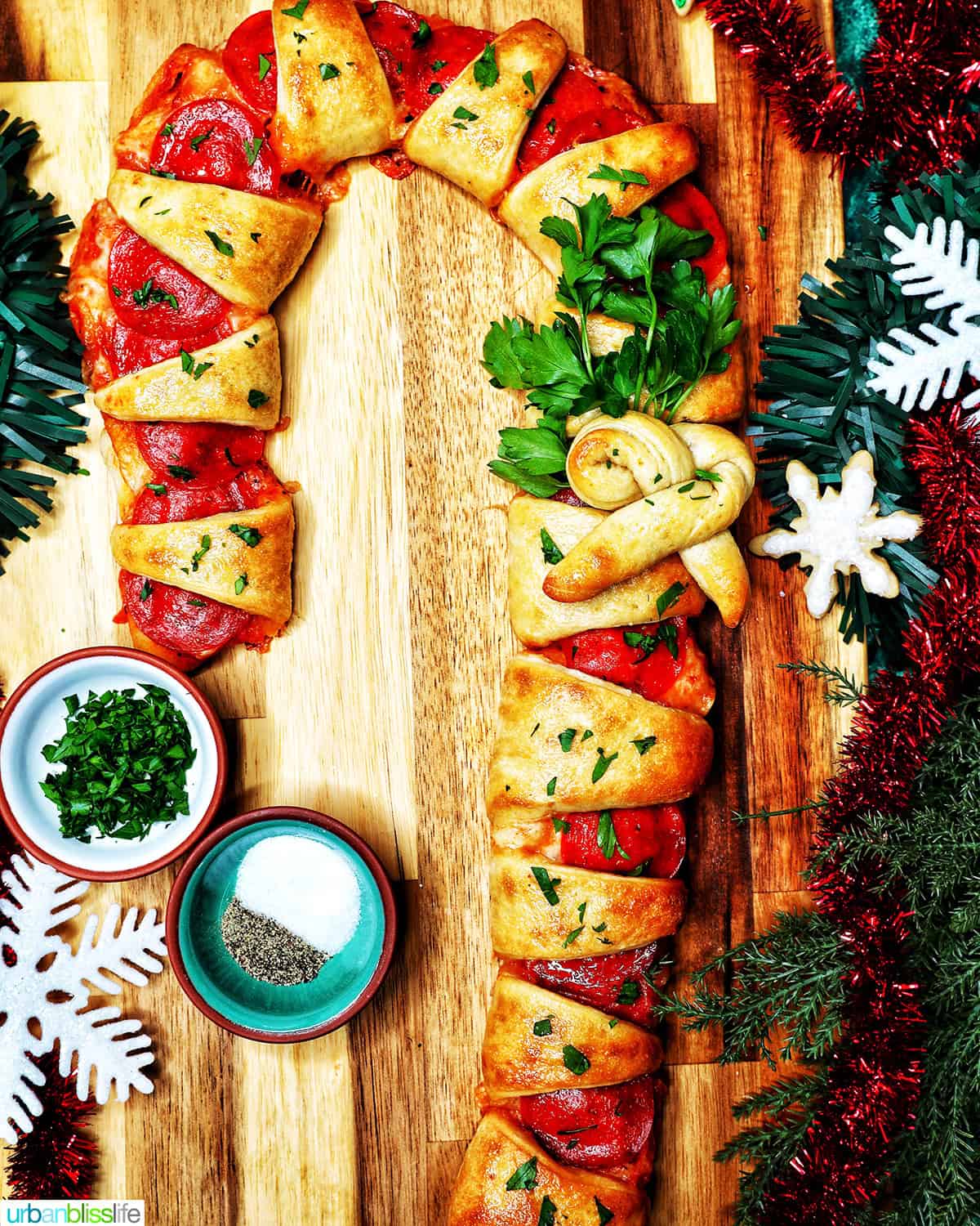 candy cane pizza surrounded by holiday decorations.
