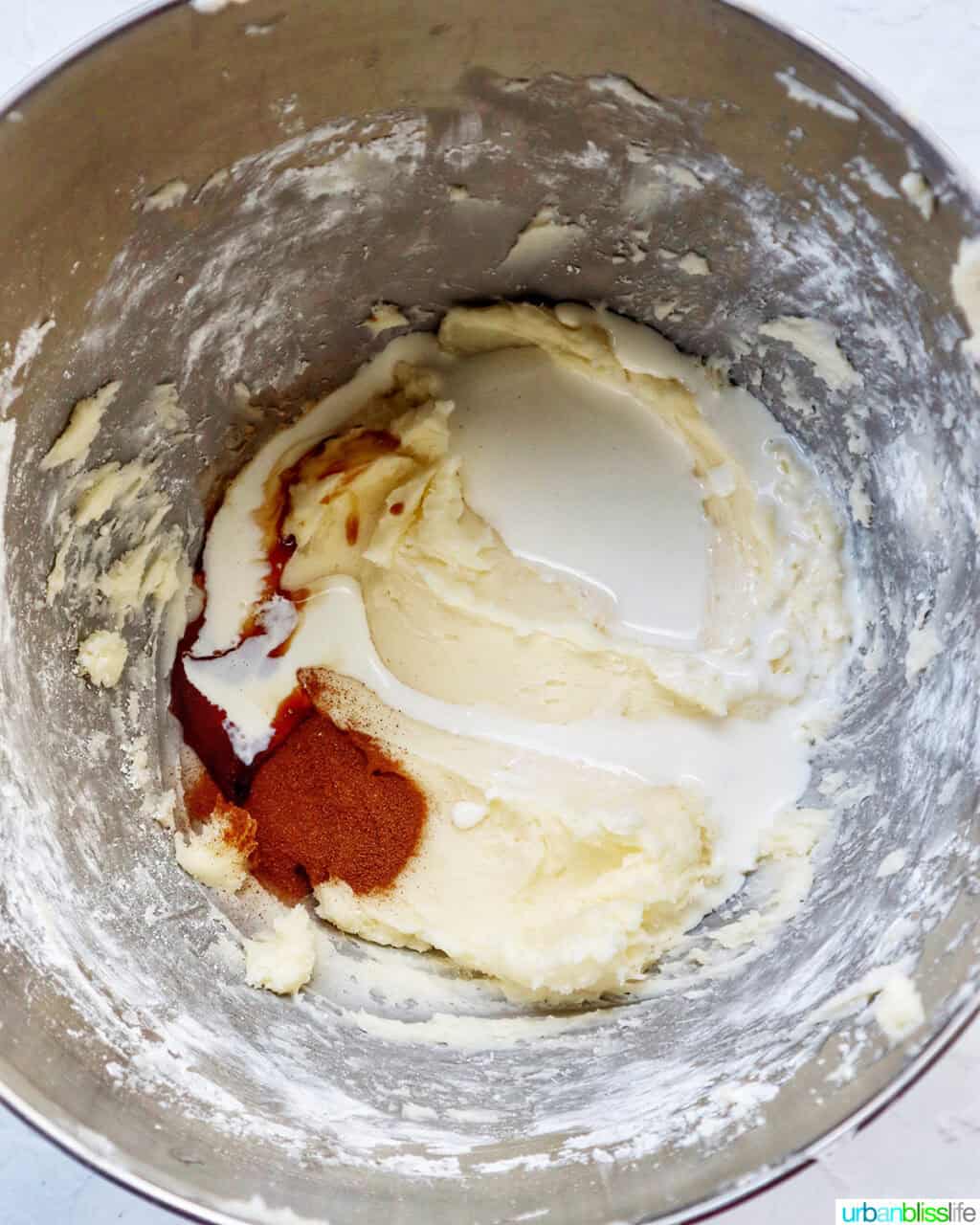 ingredients in a stand mixer bowl to make frosting.
